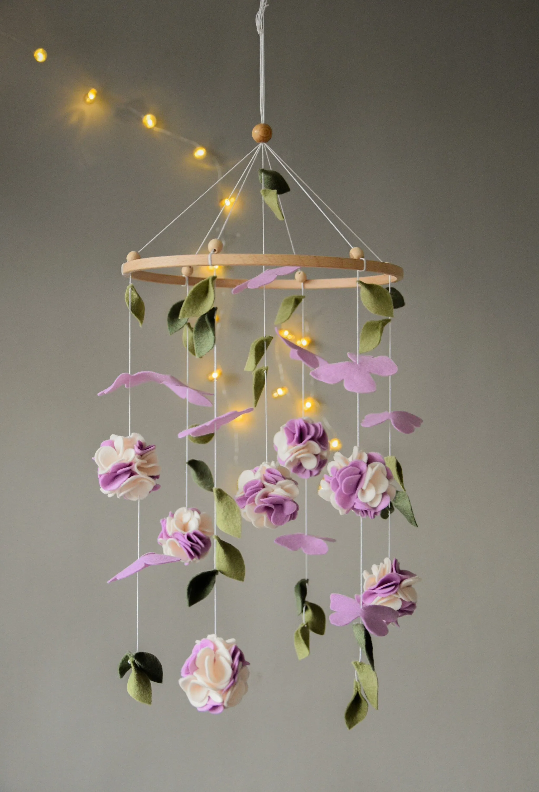 Floral mobile with purple white flower, butterfly and leaves