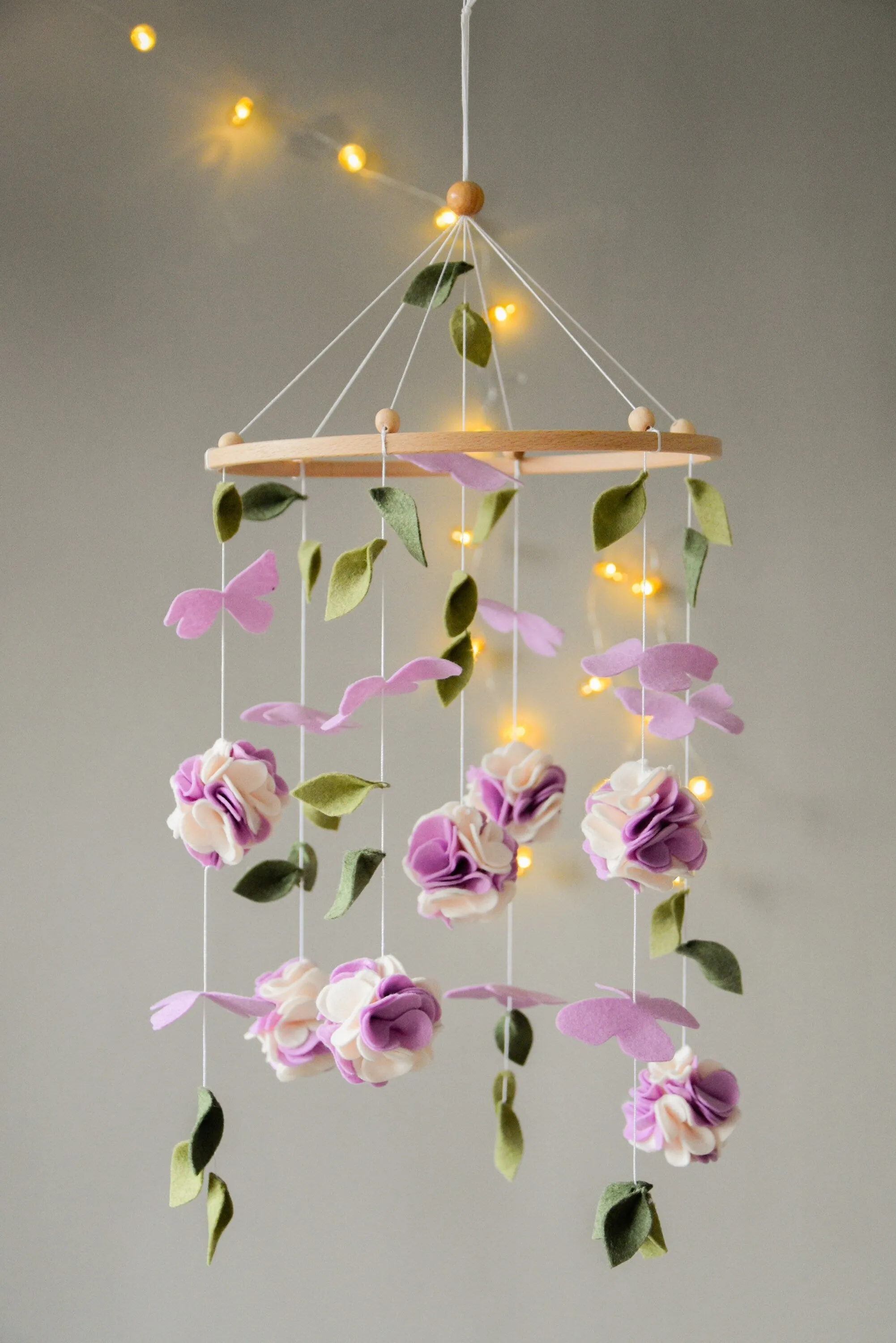 Floral mobile with purple white flower, butterfly and leaves